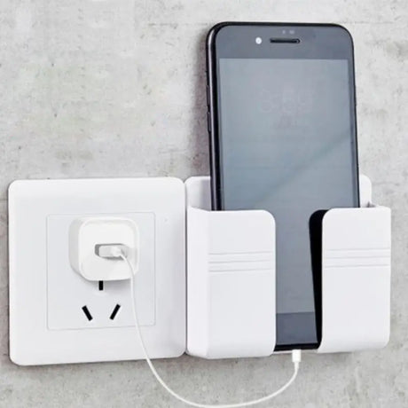 a white charging station with a phone and a white charger