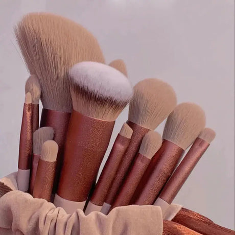 a bunch of makeup brushes in a bag