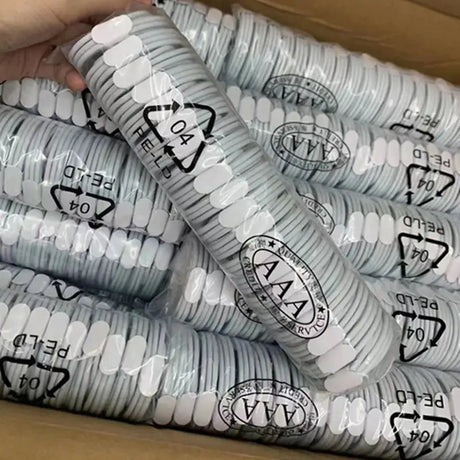 a box full of white plastic cups