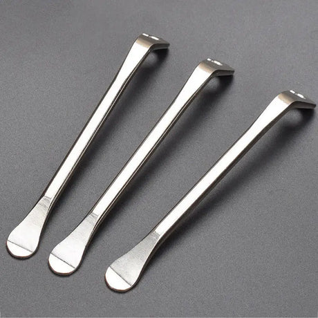 three stainless spoons with a handle