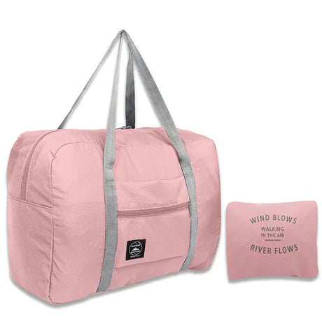 a pink duff bag with a pillow and pillow