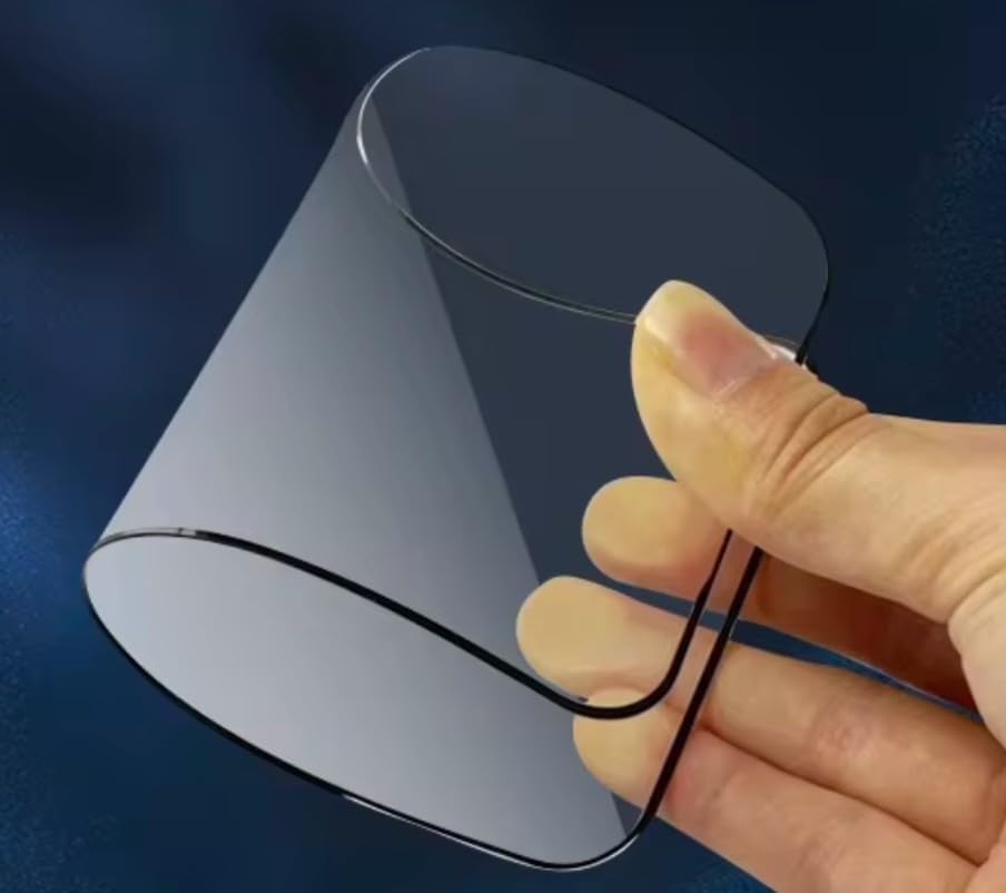 Flexible, thin, transparent glass or plastic sheet held by a hand.