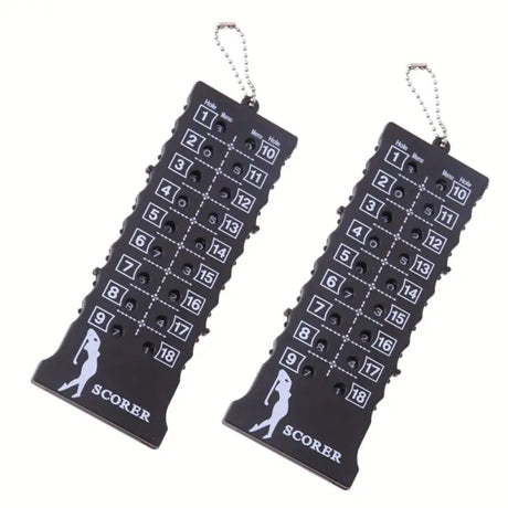 a pair of black and white golf themed earrings