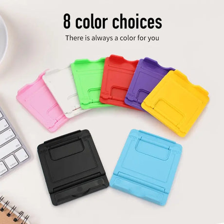 there is a colorful case for a cell phone next to a keyboard