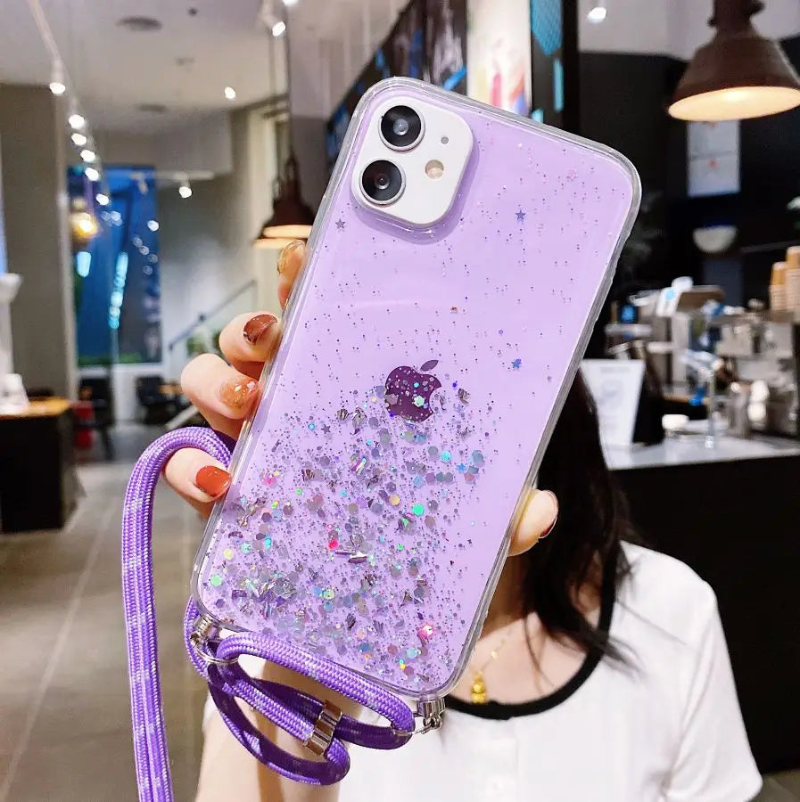 Purple glitter iPhone case with a lanyard.