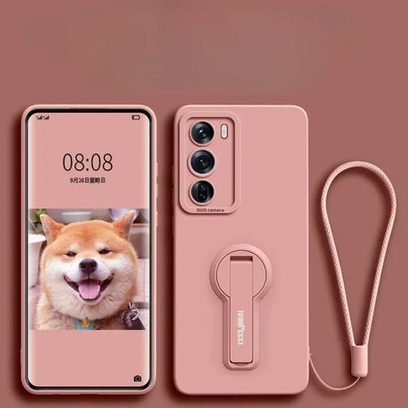 Pink smartphone with a matching case featuring a camera module, kickstand, and wrist strap.