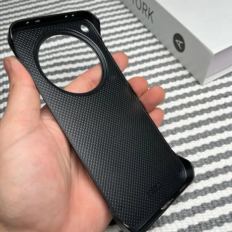 Black textured phone case with a large circular camera cutout.