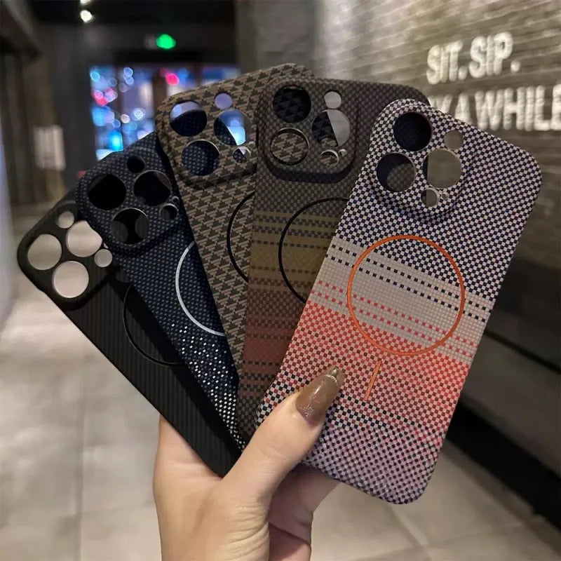 A collection of four smartphone cases with distinct patterns and camera cutouts.