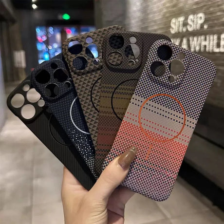 A collection of four smartphone cases with distinct patterns and camera cutouts.