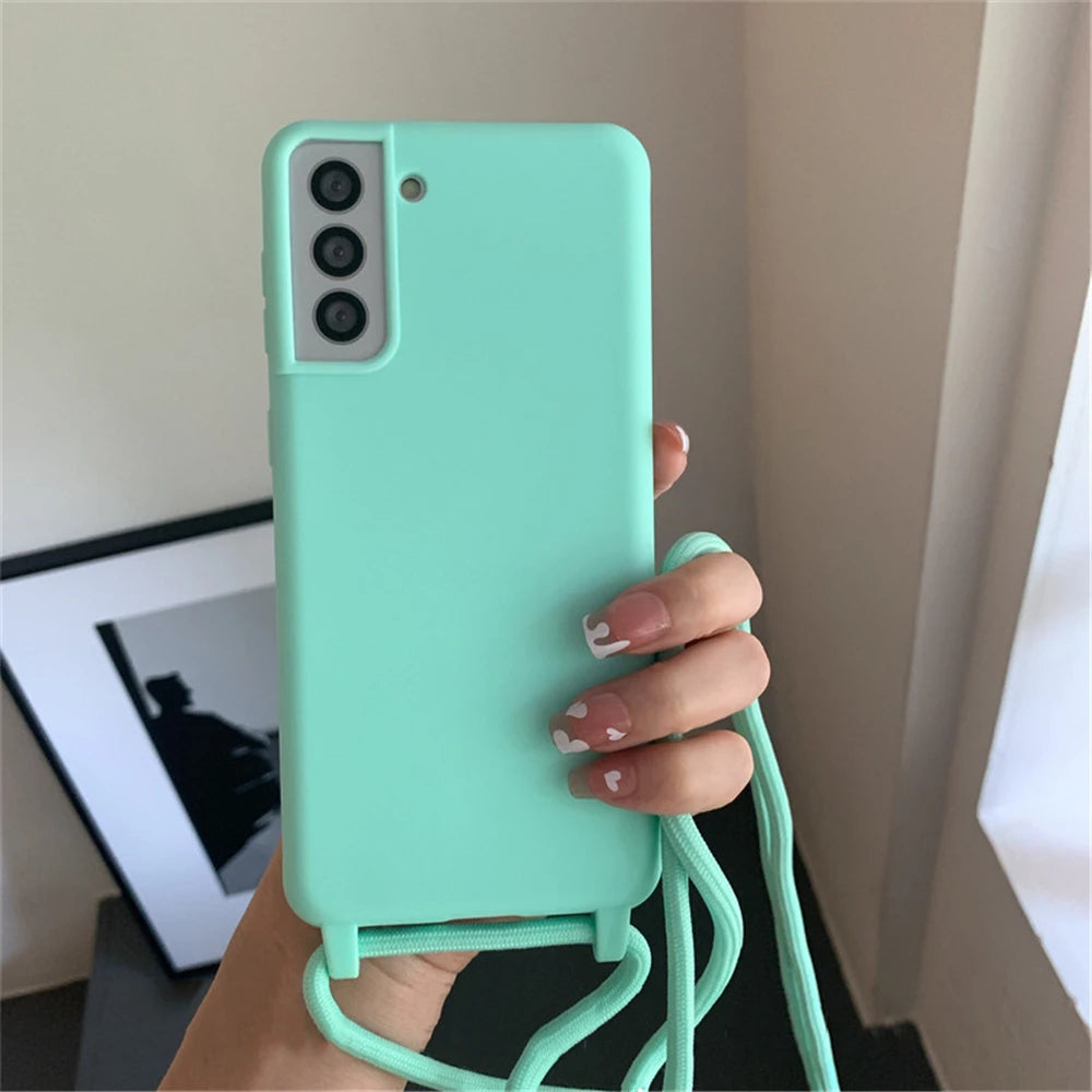 Mint green smartphone case with a built-in lanyard.
