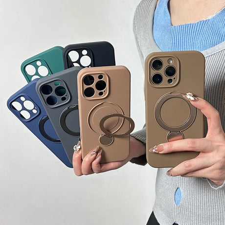 A collection of solid-colored iPhone cases with integrated magnetic rings and kickstands.