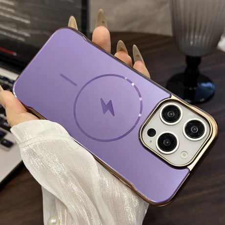 Purple iPhone case with a gold trim, MagSafe charging symbol, and a triple camera cutout.