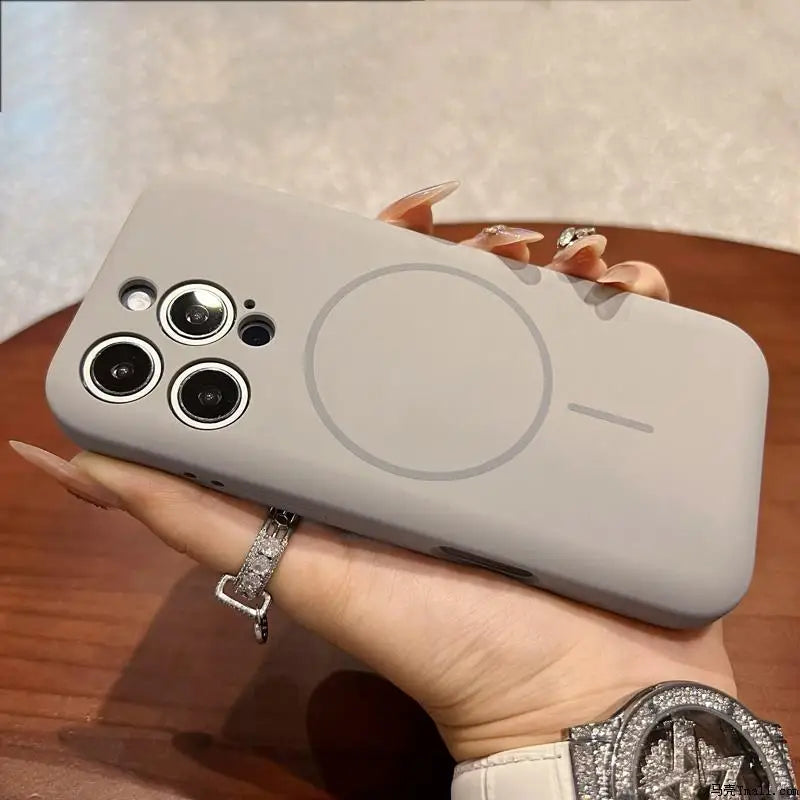 Light grey iPhone case with a triple camera cutout and a circular MagSafe charging ring.
