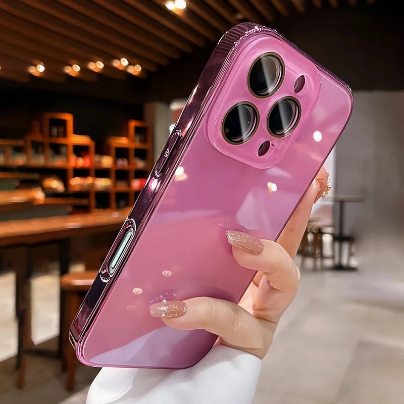 Hand holding a shiny pink phone case with a transparent camera module.