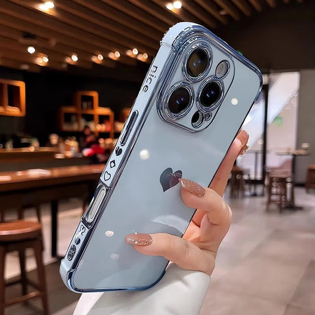 Light blue smartphone with a clear case featuring a heart design and ’nice’ text.