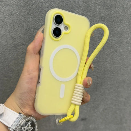 Yellow iPhone case with a white MagSafe ring and a matching wrist strap.