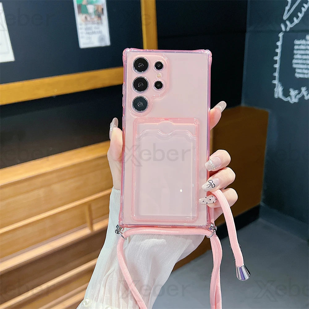 A transparent pink phone case with a card slot and a detachable lanyard.