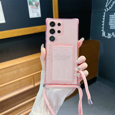 A transparent pink phone case with a card slot and a detachable lanyard.