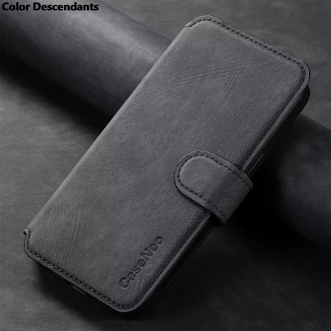 A charcoal gray faux leather wallet phone case with a magnetic strap closure.