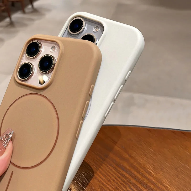 Two silicone phone cases, one tan and one white, with camera cutouts and side buttons.