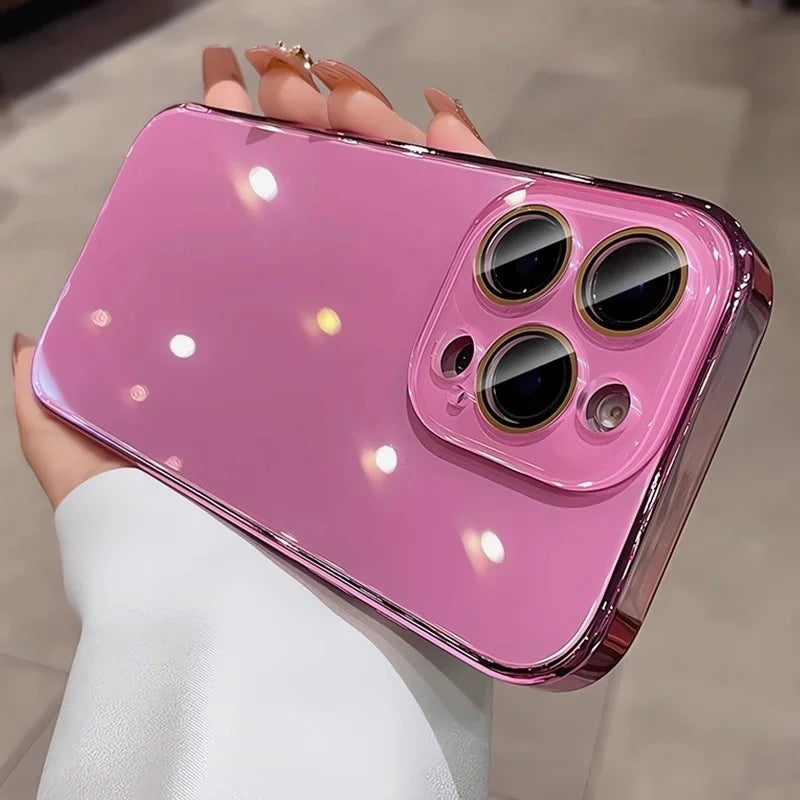 Pink reflective smartphone case with a gold-trimmed camera module.