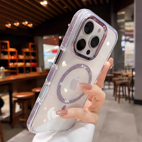 A clear phone case with glittery purple accents and a circular magnetic ring around the Apple logo.
