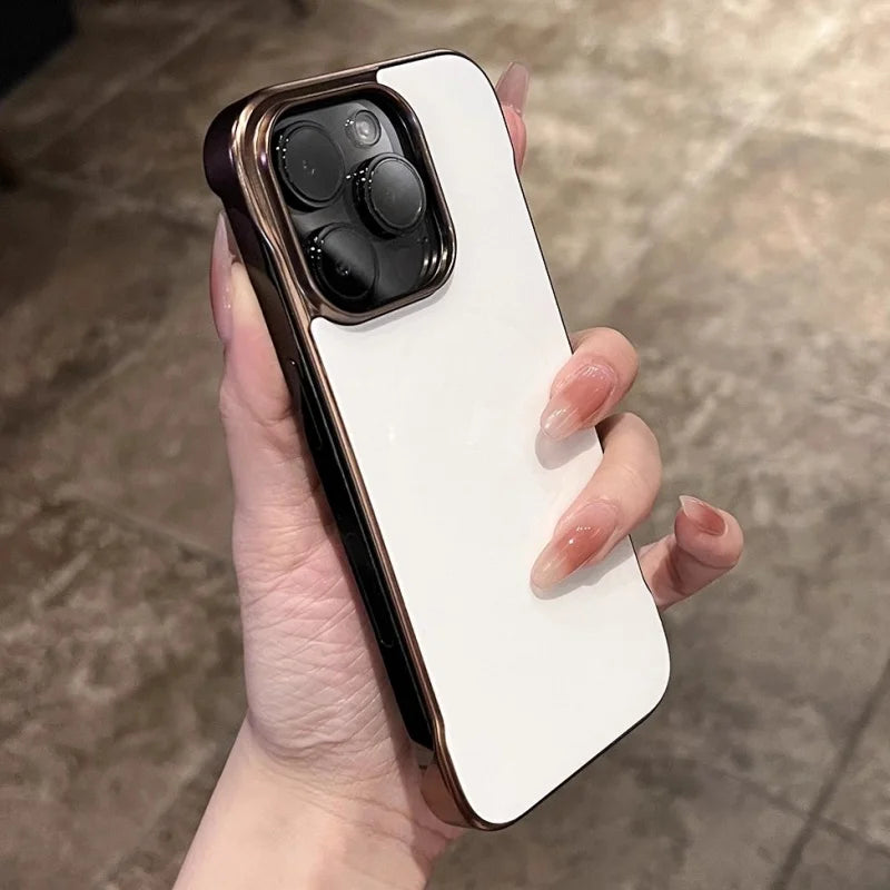 White iPhone with a gold-trimmed case.