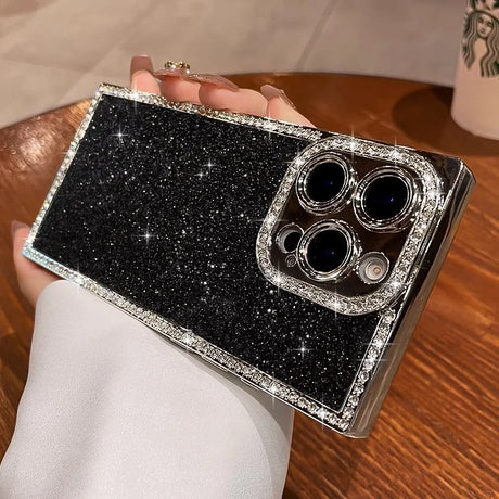 A black glittery smartphone case with a diamond-studded frame and camera cutout.