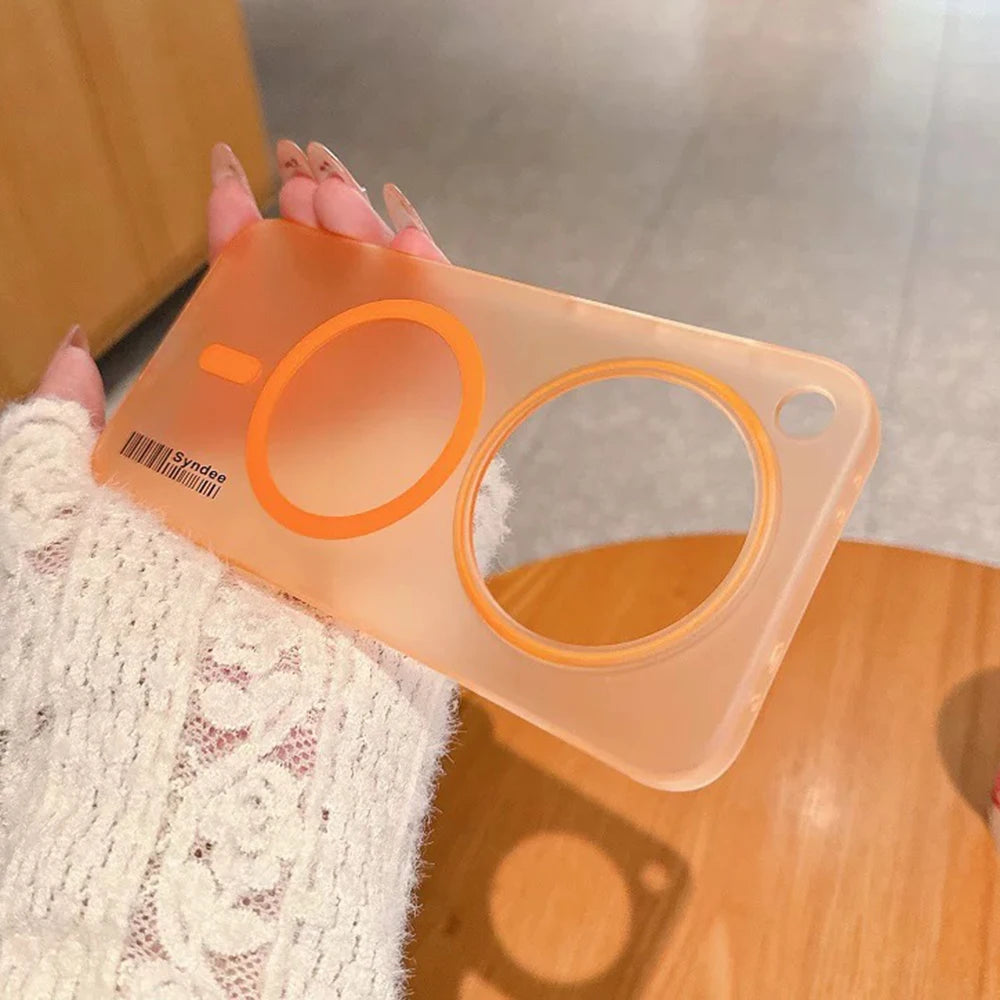Translucent orange phone case with two prominent circular cutouts and a small hole for a strap.