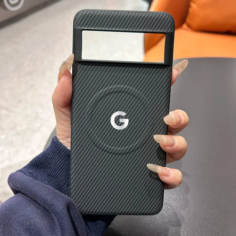 Black carbon fiber Google Pixel phone case with a camera cutout and white G logo.