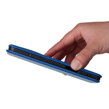 A blue folio case for a tablet or e-reader, held by a hand.
