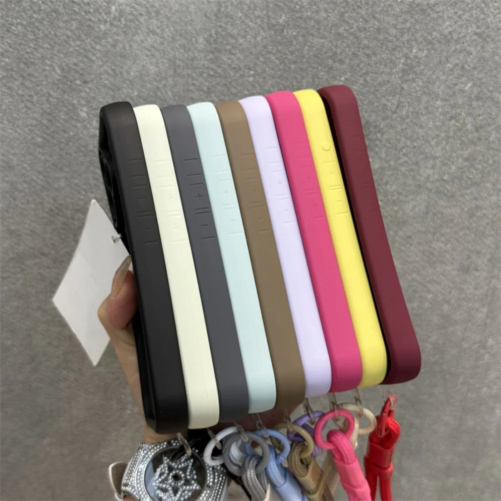 A collection of colorful smartphone cases with attached lanyards.