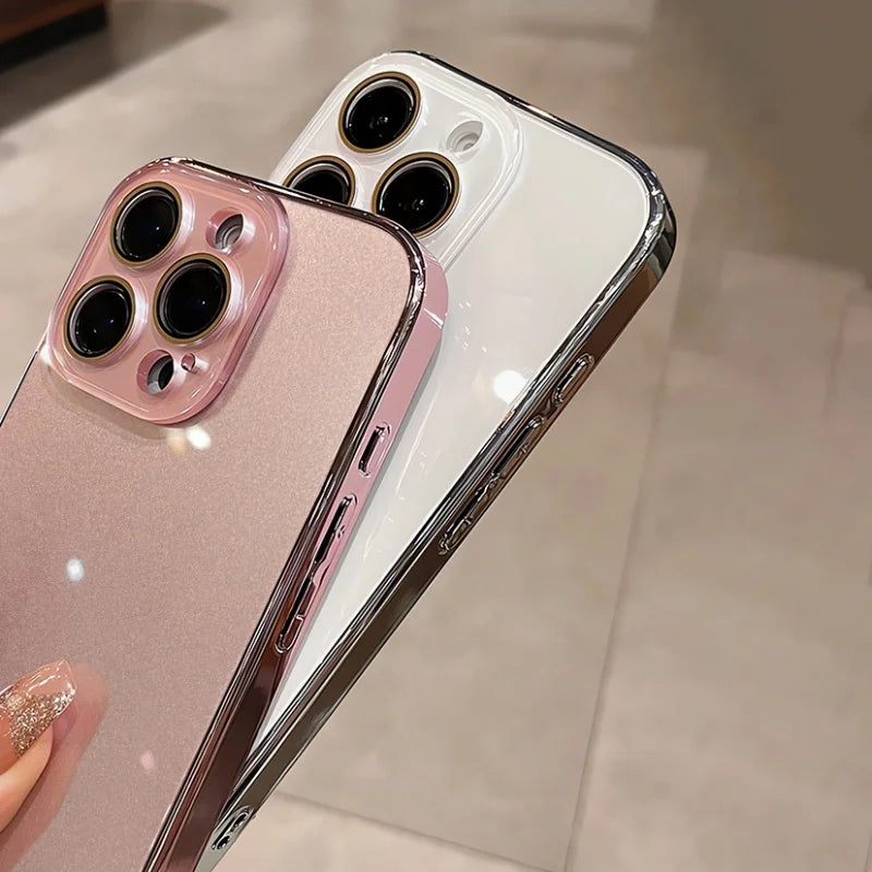 Two smartphones with clear, shiny cases, one pink and one white.