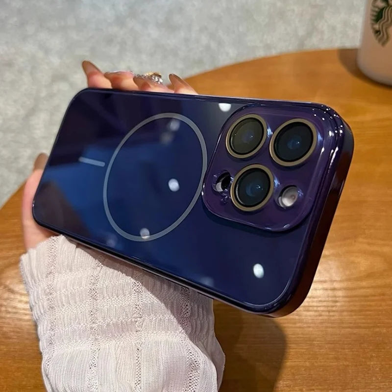 A shiny dark blue smartphone with three prominent camera lenses and a circular magnetic charging indicator on the back.