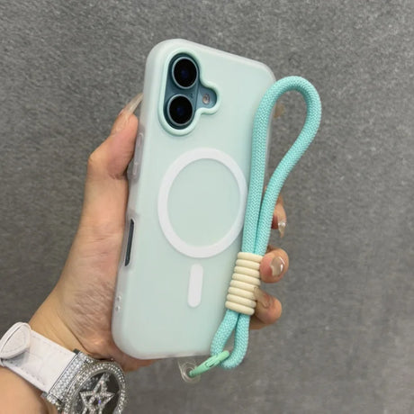 A light blue iPhone case with a white MagSafe ring and an attached mint green wrist strap with beige accents.