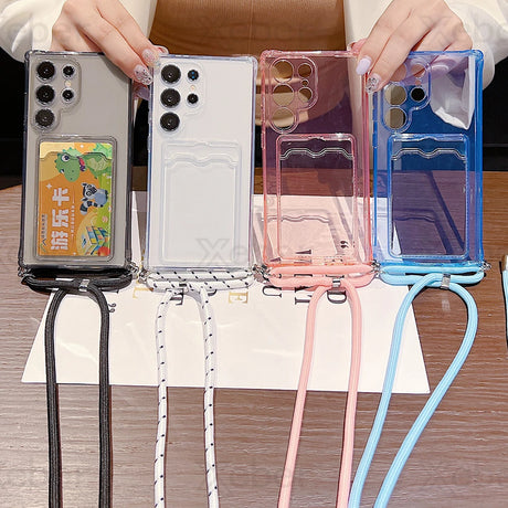 Four transparent phone cases with attached lanyards and card slots.