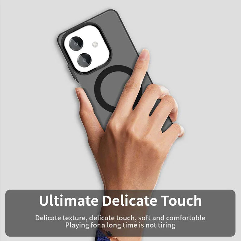 Hand holding a gray smartphone with a camera lens protector and a magnetic ring on the back.