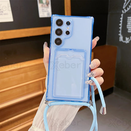 Light blue transparent phone case with a lanyard and a card slot.