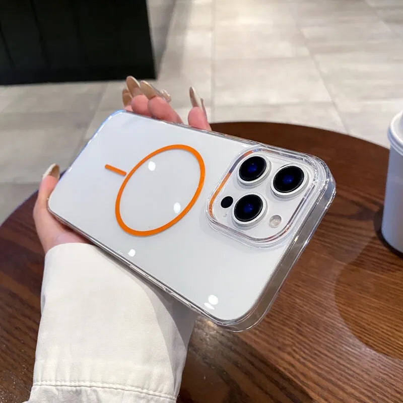 A white smartphone with three camera lenses and an orange circular magnetic charging symbol, encased in a clear protective cover.