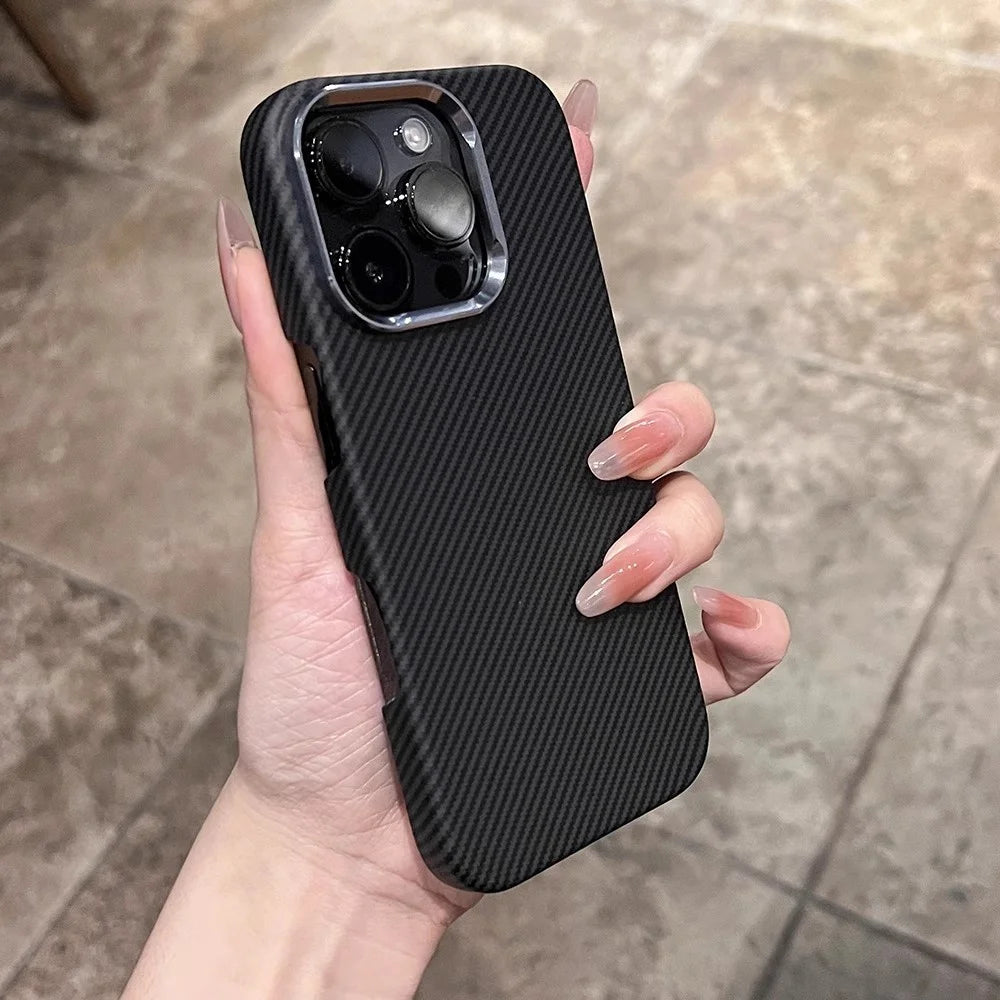 A black carbon fiber phone case with a silver camera bezel.