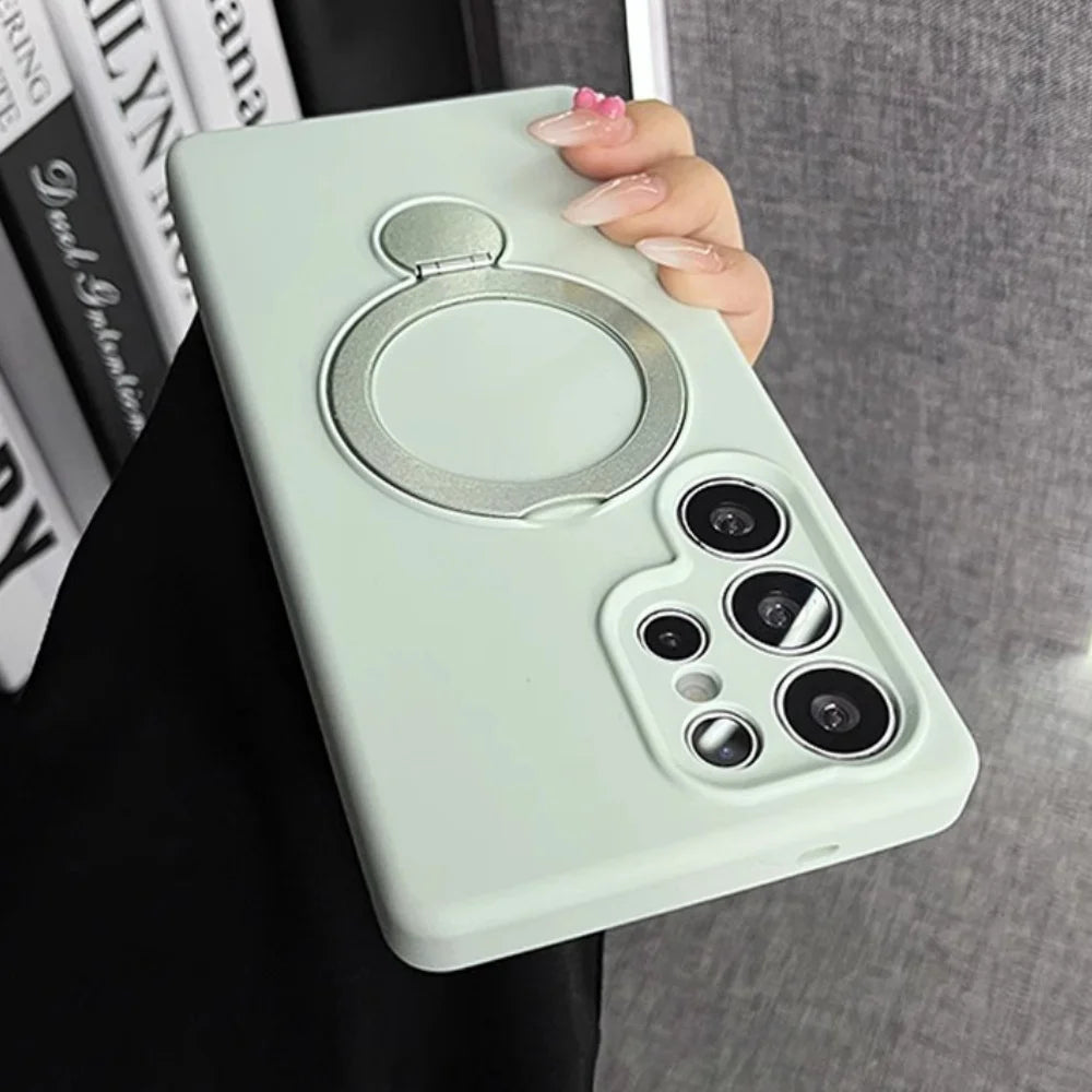 Light green smartphone case with a built-in silver ring holder.