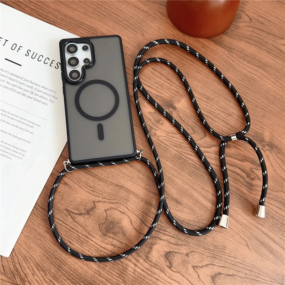 A dark gray phone case with a magnetic ring and a black and white patterned lanyard.