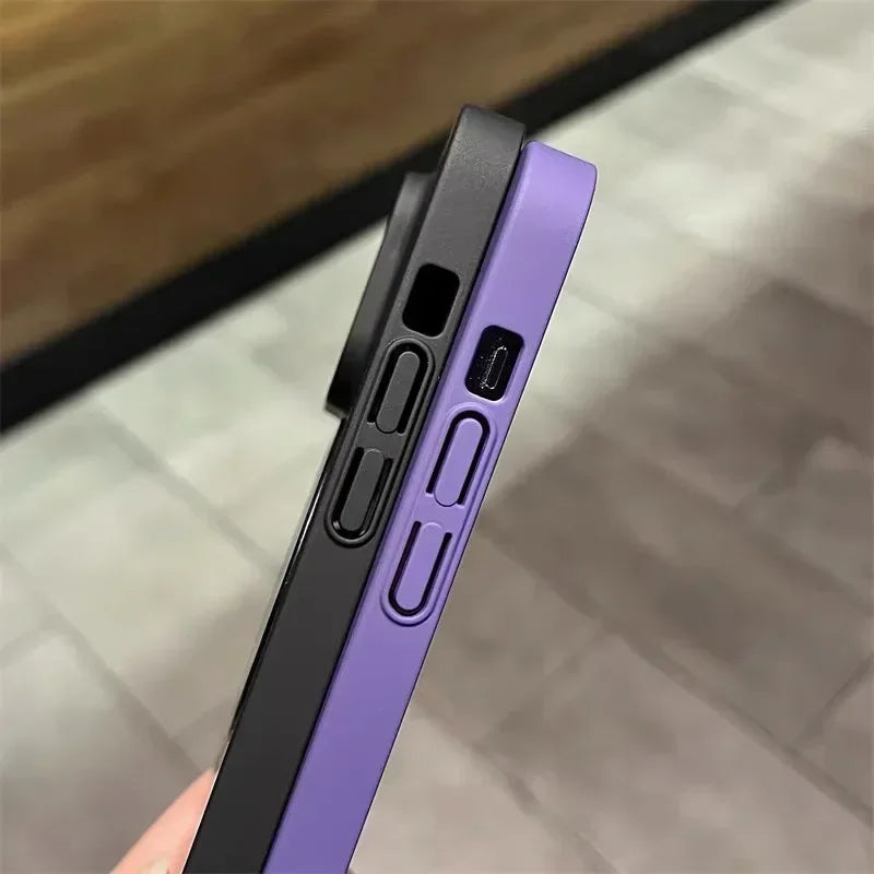 Two silicone phone cases, one black and one purple, showing their side button and port cutouts.