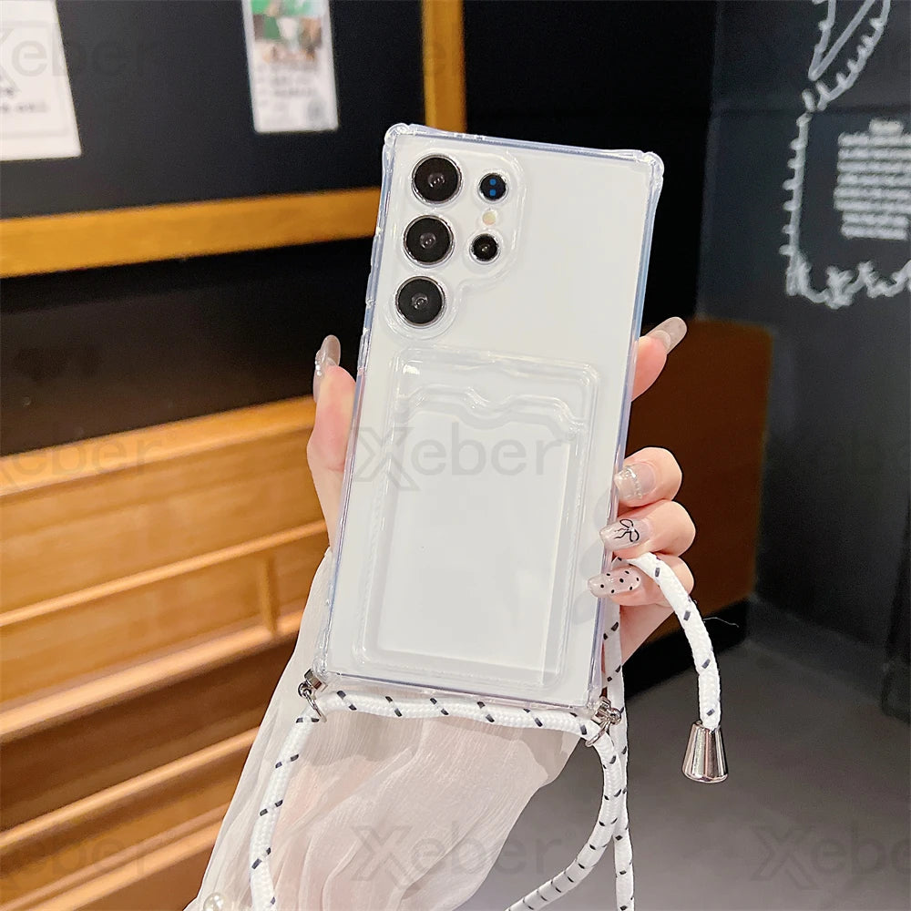 Clear smartphone case with a card slot and an attached black and white lanyard.
