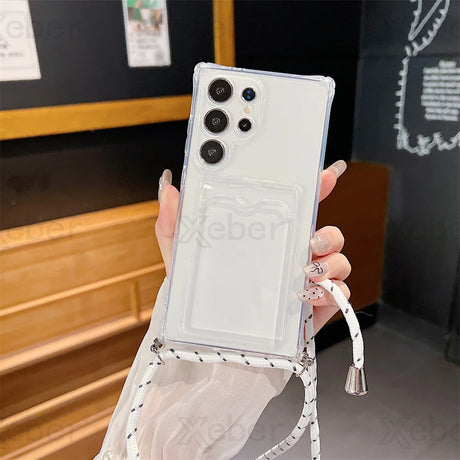 Clear smartphone case with a card slot and an attached black and white lanyard.