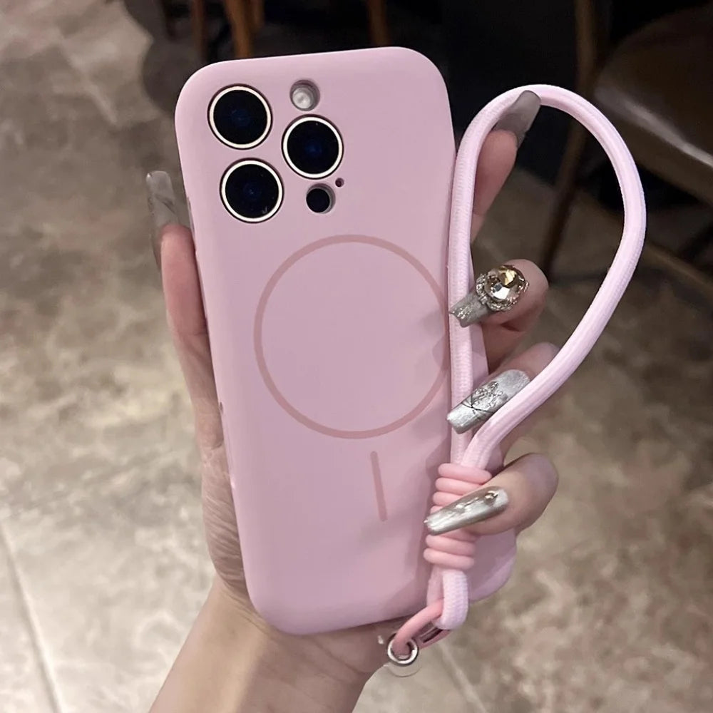 Pink silicone phone case with a built-in strap and MagSafe ring.