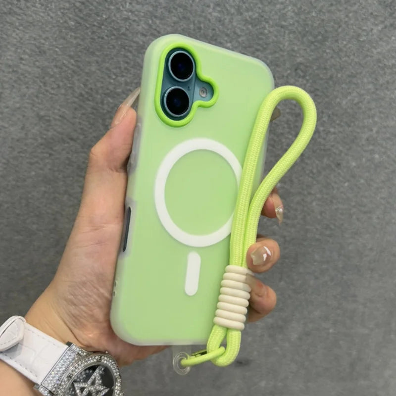 Light green silicone phone case with a Magsafe ring and a neon yellow lanyard wrist strap.