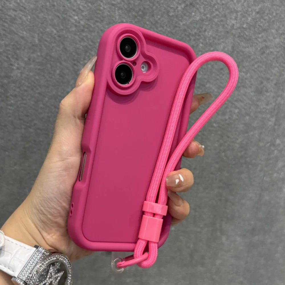 Pink silicone phone case with a wrist strap.