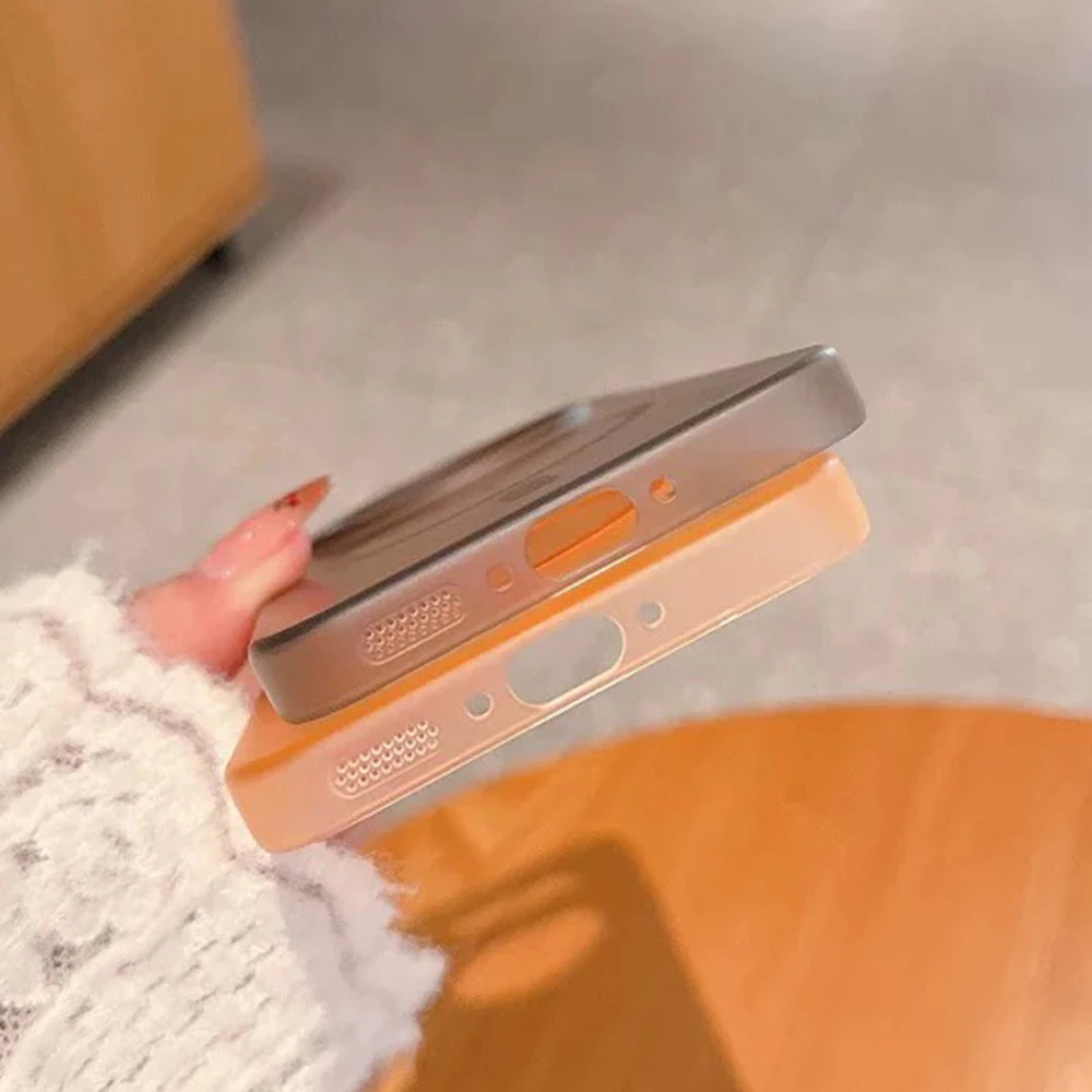 Two translucent phone cases, one grey and one peach, with cutouts for ports and buttons.