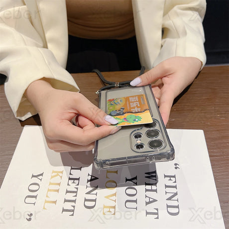 A clear smartphone case with a card slot and a detachable lanyard.